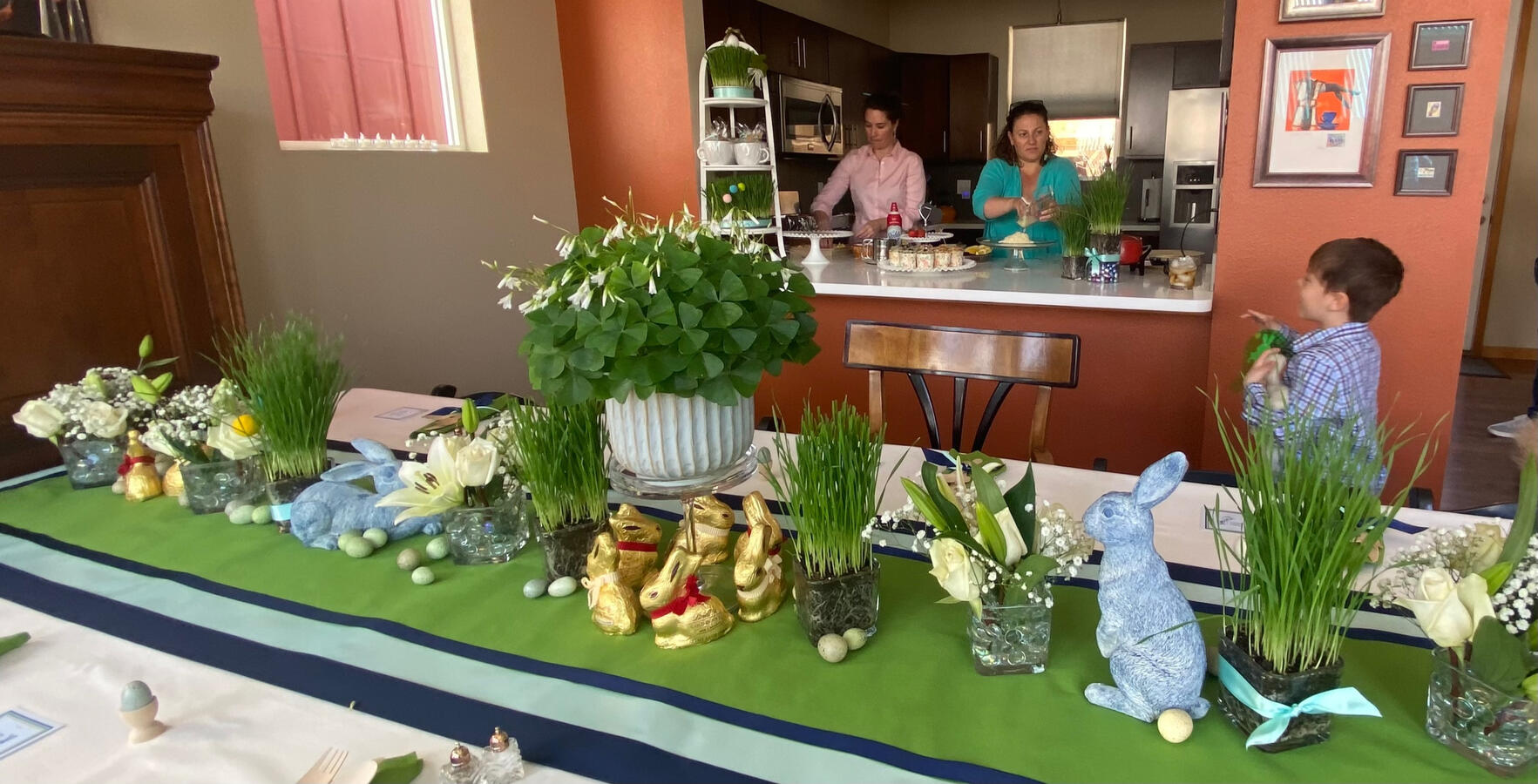 Fresh greens, seasonal florals, and playful details create a lively spring table designed for Easter gathering.