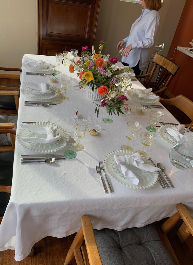 Fenton Silvercrest milk glass paired with cut glass and yellow and green Depression glass creates a light-filled table designed for gathering.