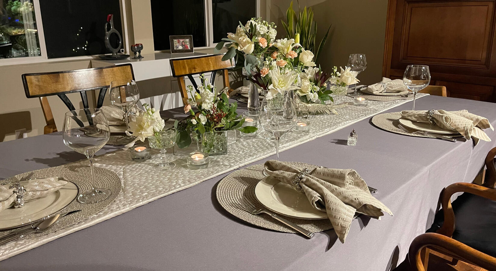 Classic Lenox Montclair china, first introduced in 1949, paired with modern glass and soft florals for an inviting table designed for conversation.